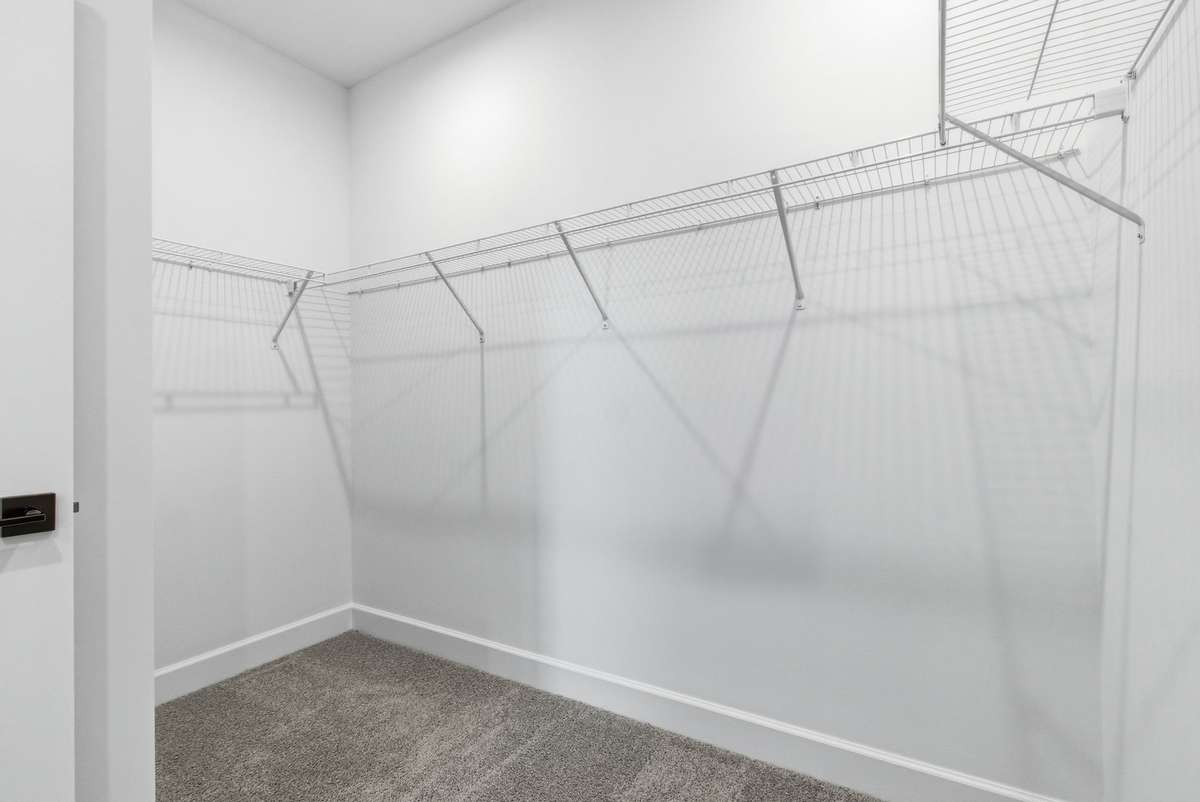 Primary walk-in closet.