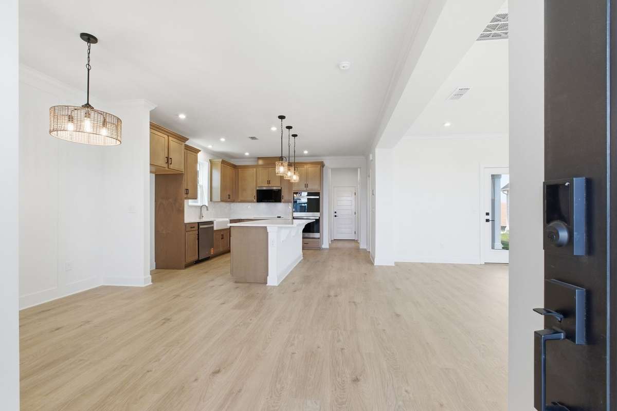 Step inside this stunning Chadwick home with open concept kitchen, dining and great room.
