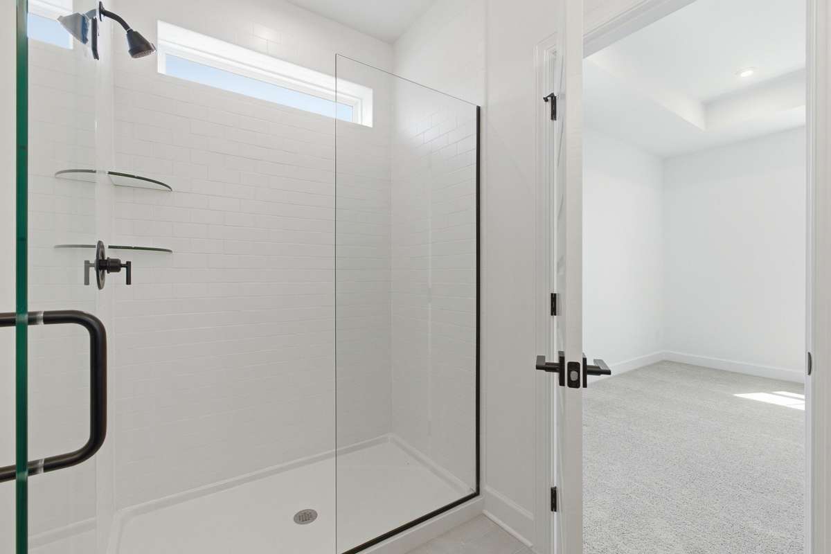 Primary En Suite with frameless glass.