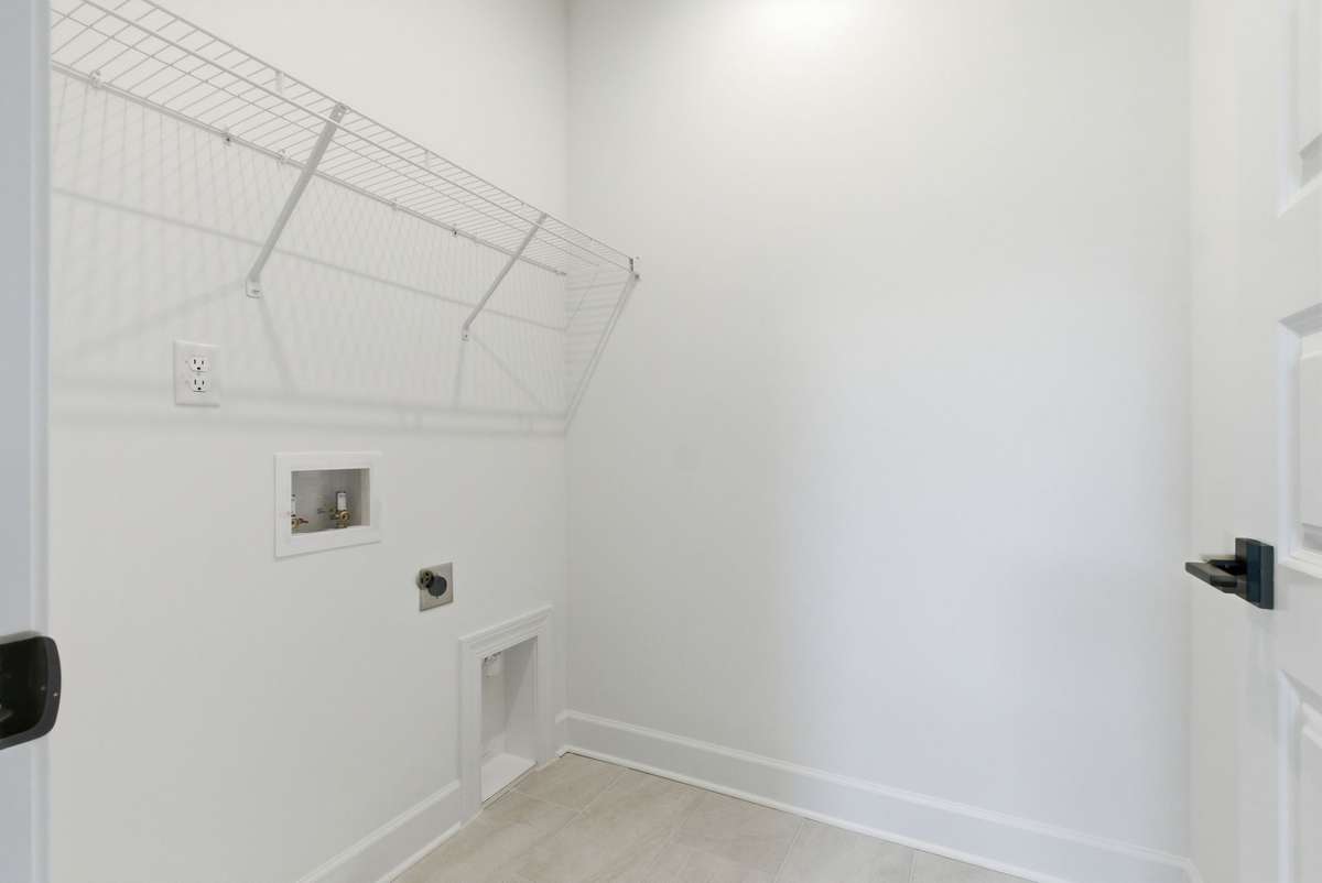 Upstairs laundry room is convenient for all bedrooms.