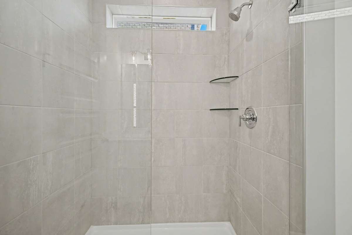 Primary en suite with oversized shower.
