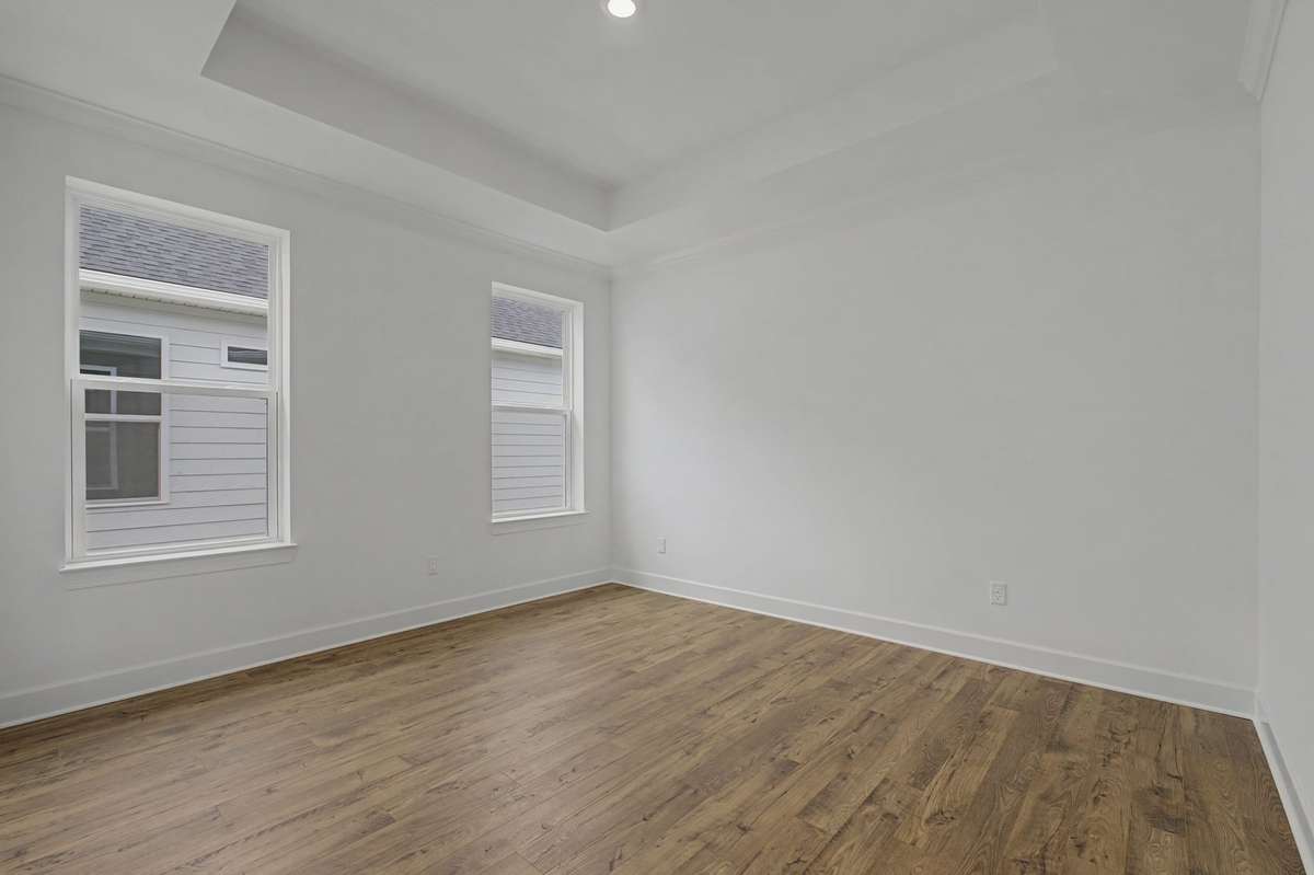 Primary Suite with hard surface flooring.