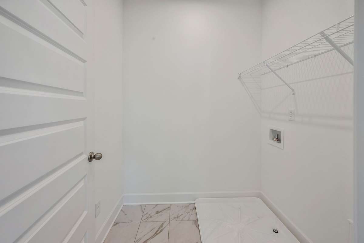 Central laundry located upstairs with all bedrooms.