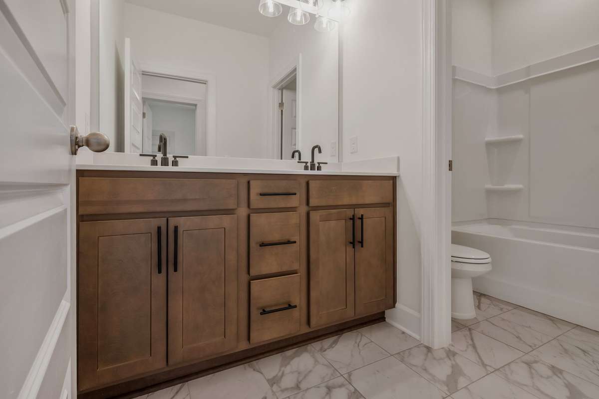 Shared bathroom servicing bedrooms 2 and 3.