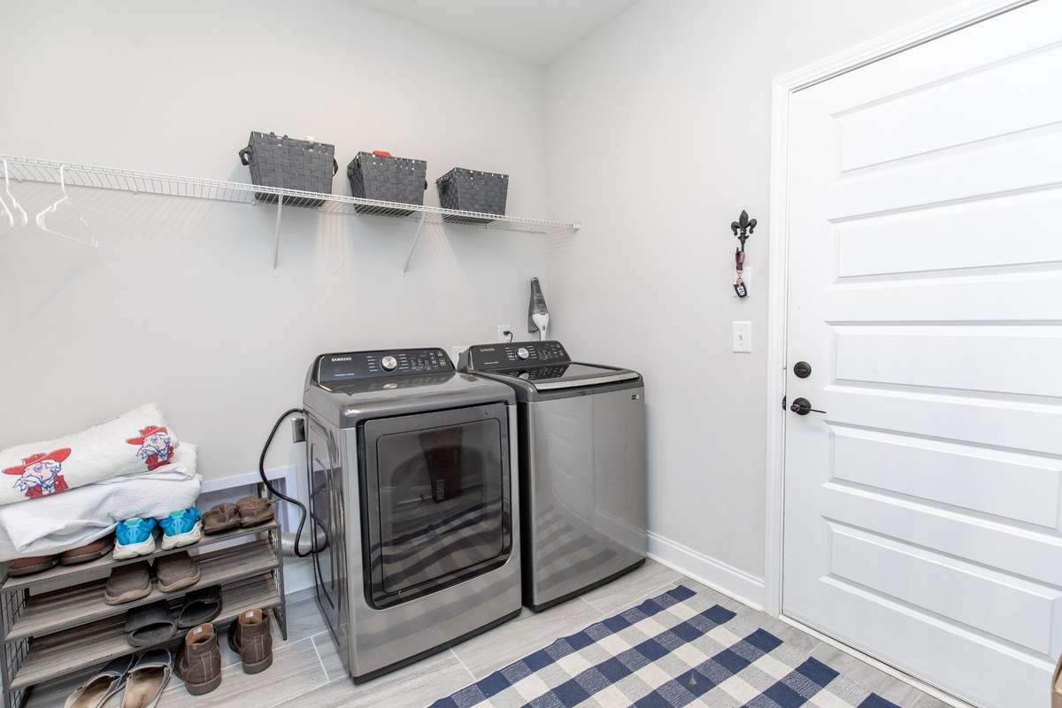 Enormous laundry room with a closet perfect for cleaning supplies