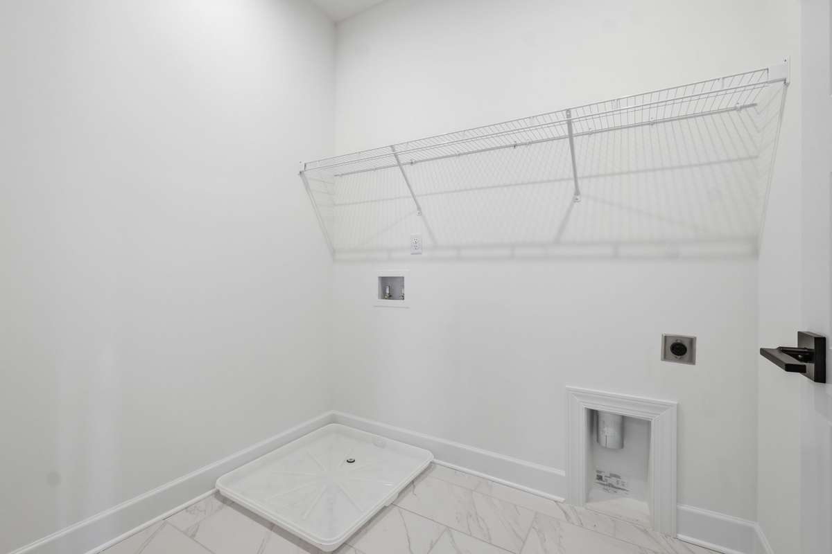 Upstairs laundry is convenient for all bedrooms.