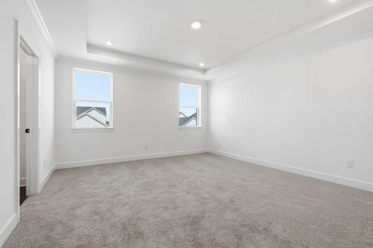 Upstairs primary suite with trey ceiling!
