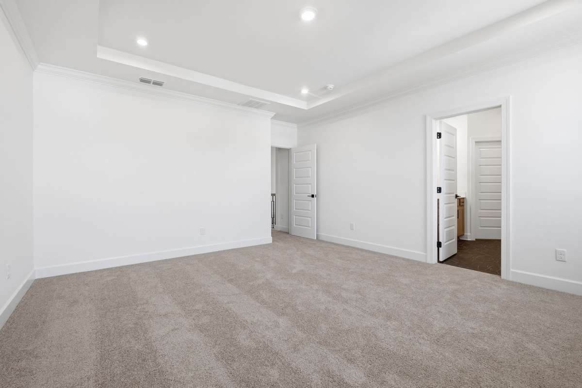 Upstairs primary suite with trey ceiling!