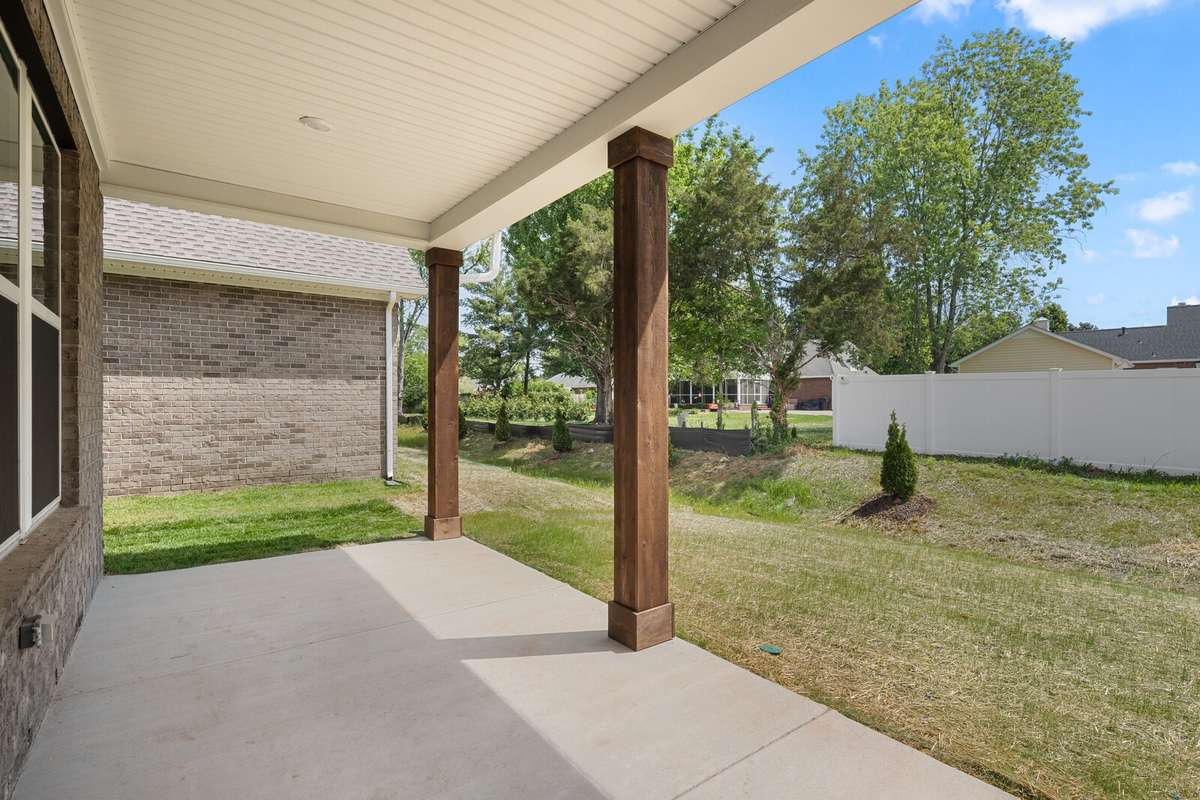 Rear covered porch faces east-- perfect for enjoying the summer evenings!
