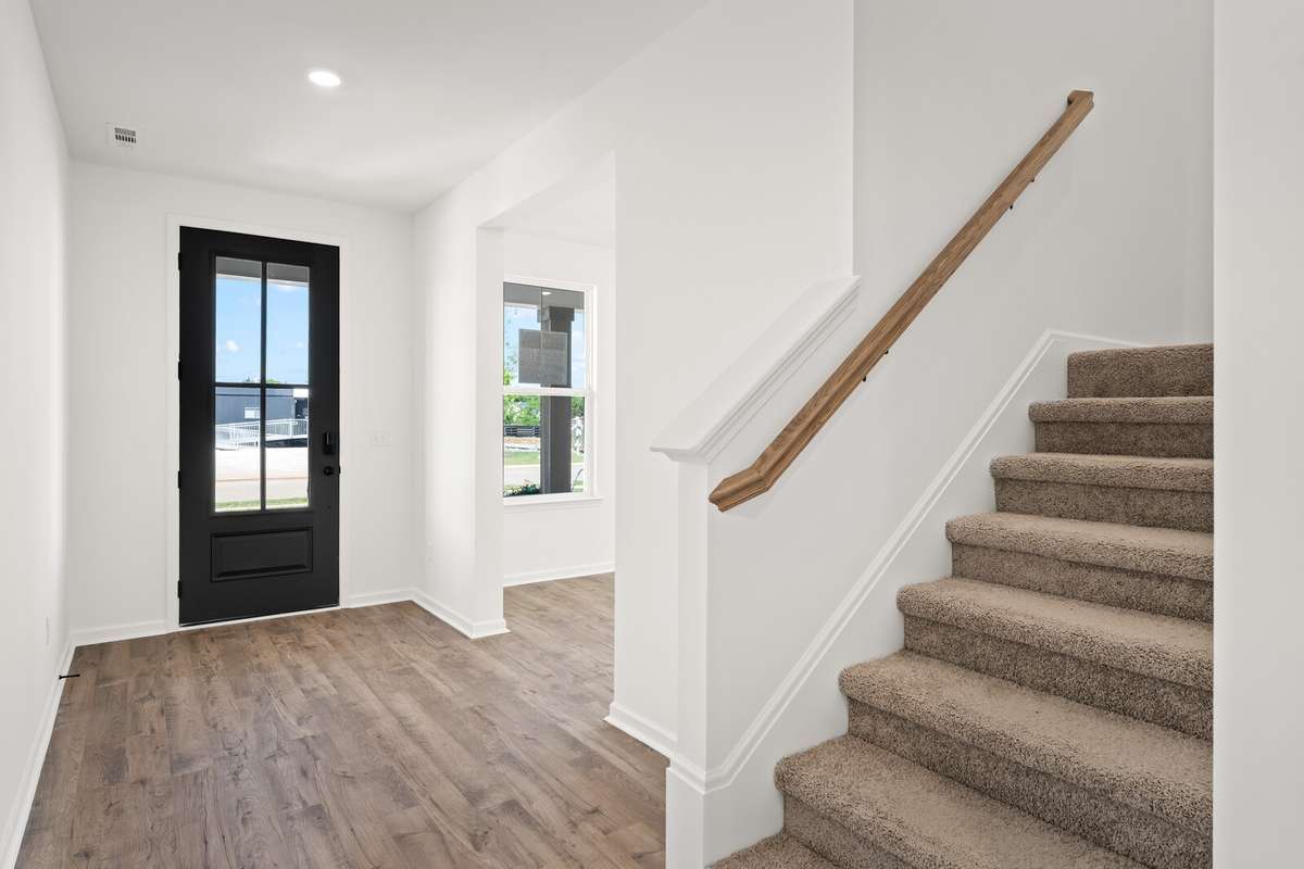 4-lite front door allows beautiful natural light into the foyer