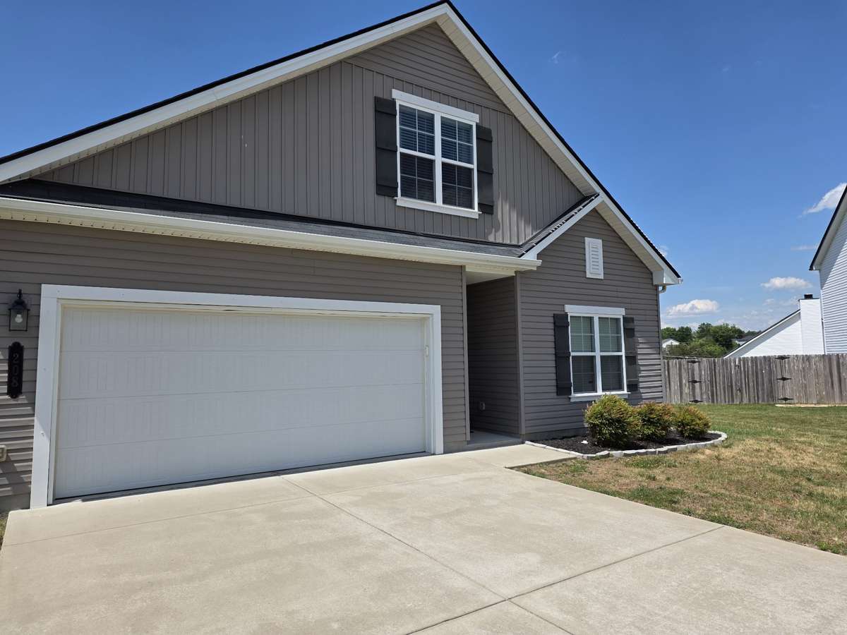 Large 2 car garage provides enough space for additional storage, lawn equipment, and outdoor toys.