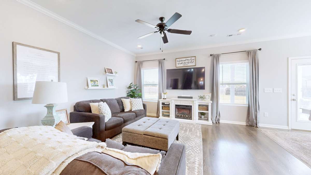 Main living area adjacent to the dining area and kitchen. Open concept is ideal for entertaining friends and family.
