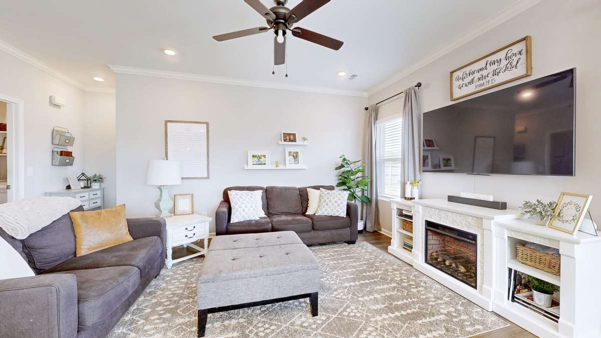 Another view of the living area. Primary suite sits just behind the wall through the little entry hallway.