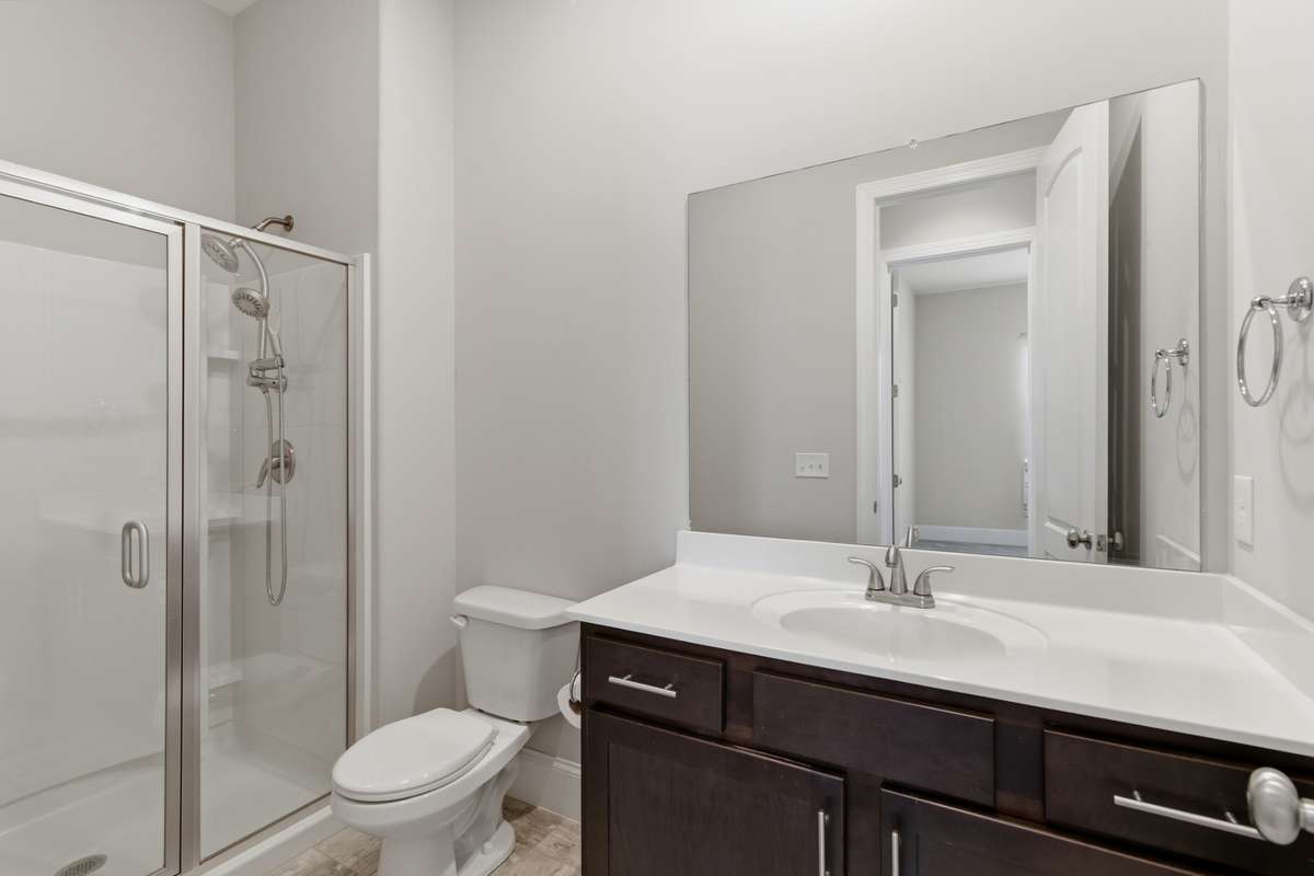 Second full bathroom with a walk-in shower.