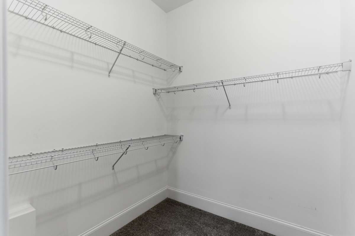 Walk-in closet accessible through the master bathroom.