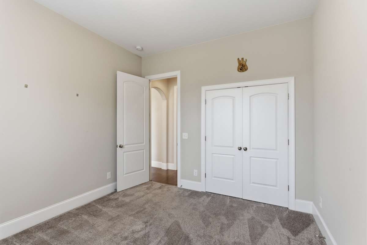 Second bedroom with an oversized closet and a nearby full bath.