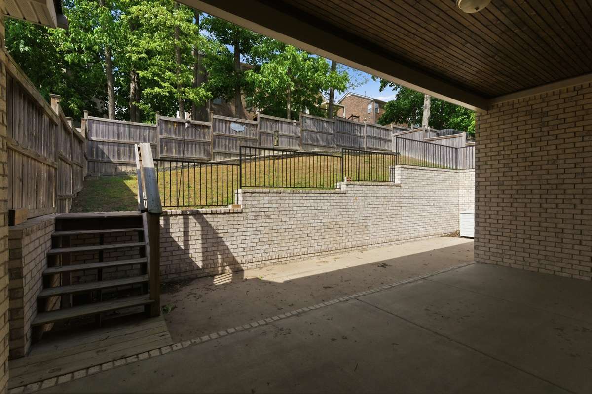 Cover back patio with access to the low-maintenance fenced backyard.