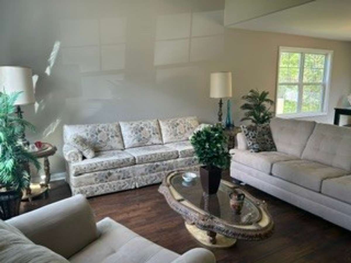 Living room has high ceiling.