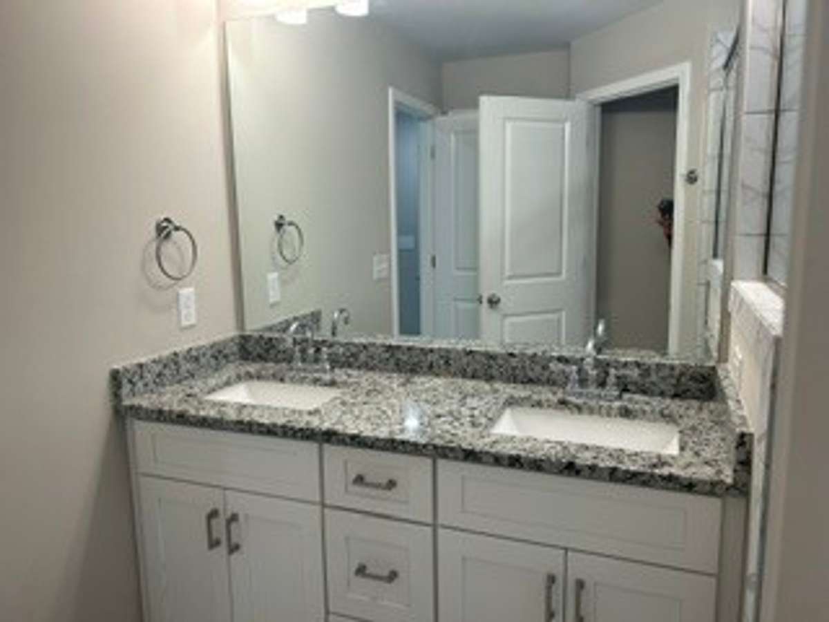 Master Bath with Double Vanity granite counter top.