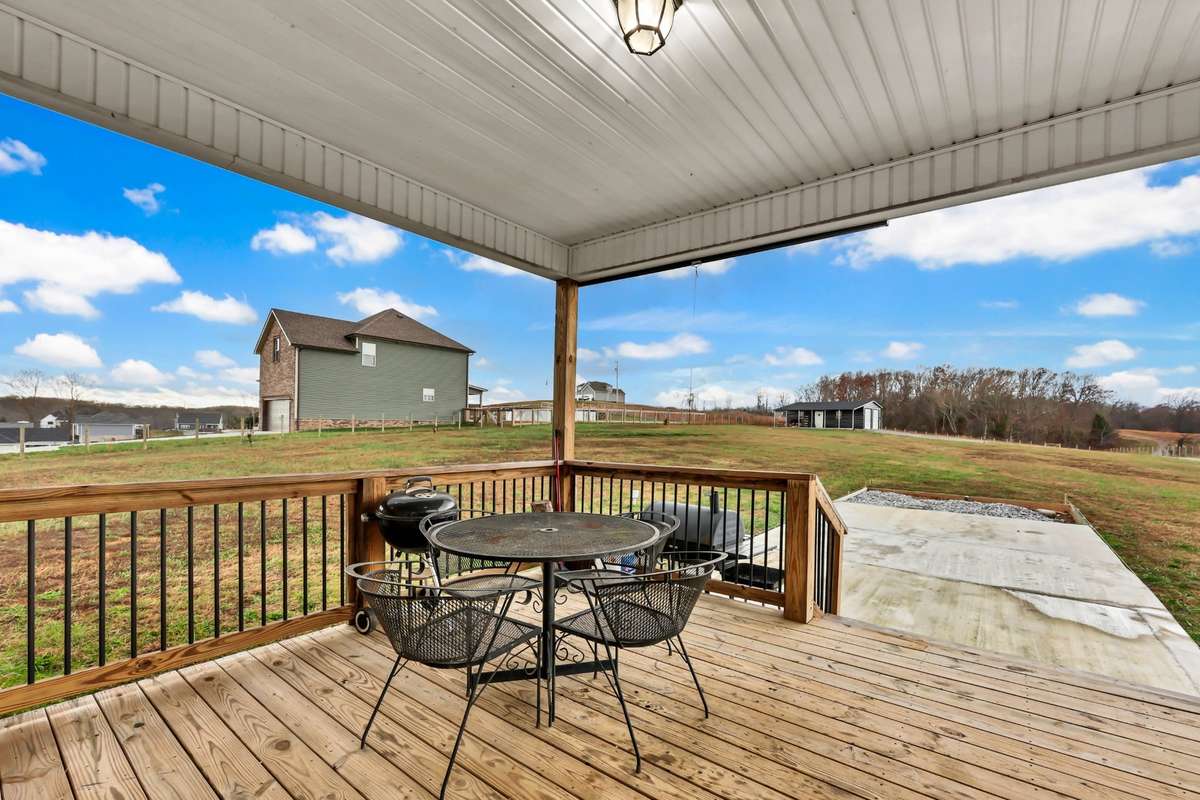 Enjoy a covered back deck with beautiful views of the private 1.5-acre lot.