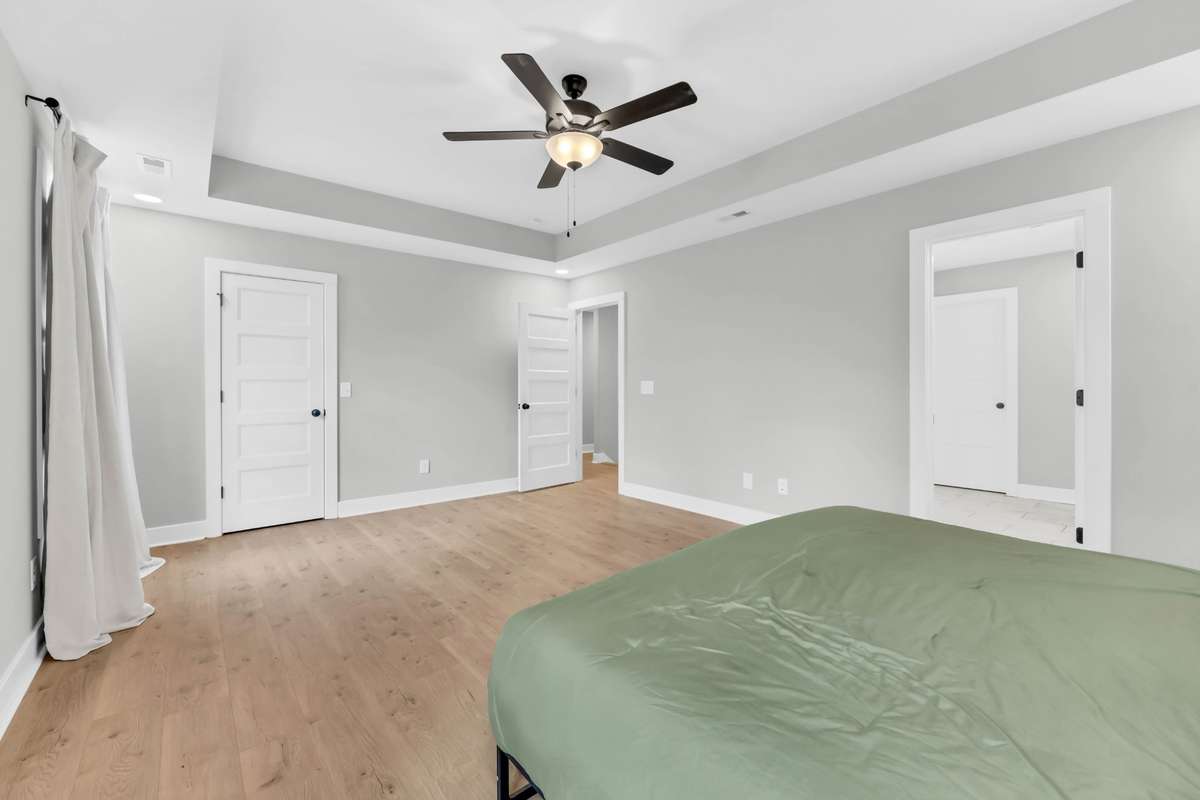 Offers a private en suite bath and a roomy walk-in closet.