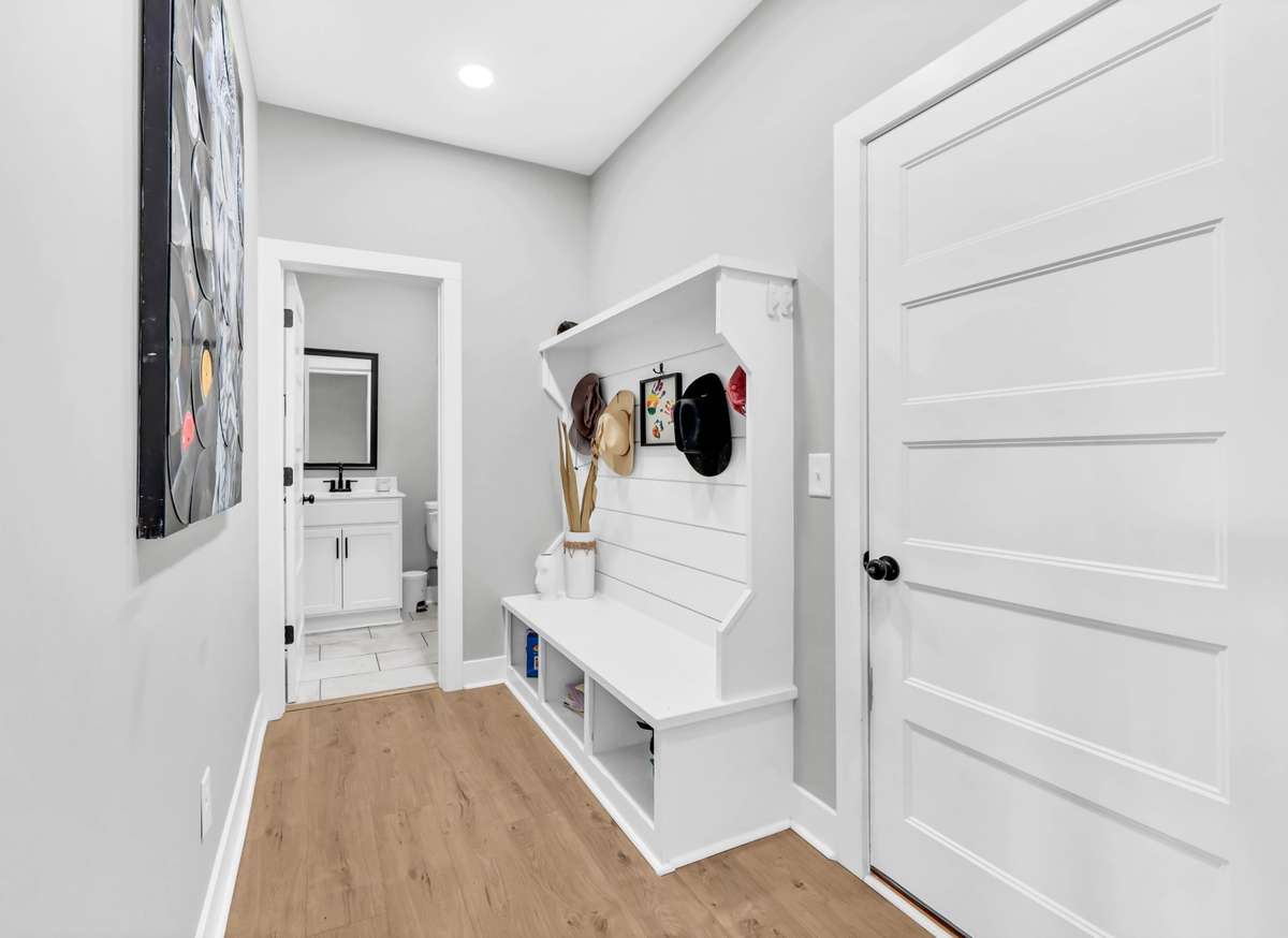 Hall Tree inside garage entry perfect for dropping jackets, purses, backpacks