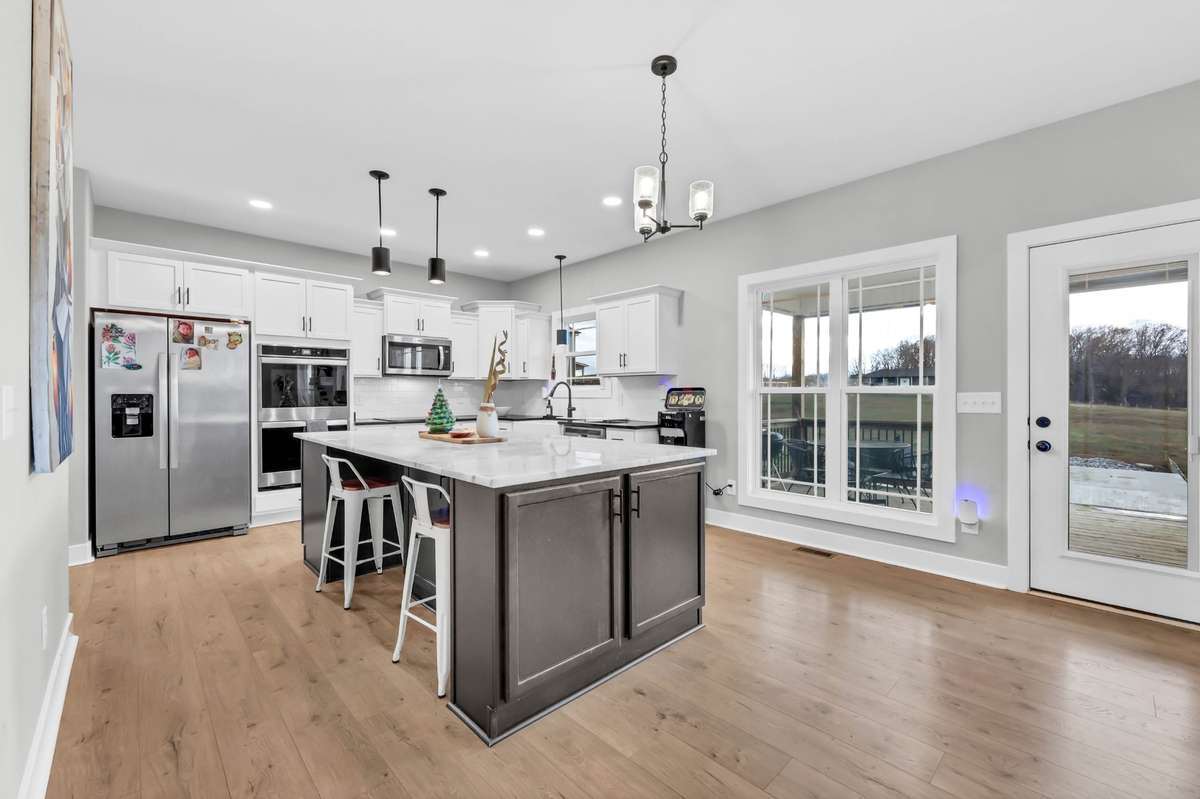 At the heart of the home is the extra-large kitchen island, where everyone naturally comes together to cook, chat, and unwind.