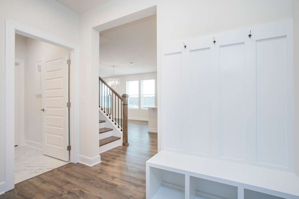 Entry from garage! Build a Lexington on a lot of your choice!! Photos are of an example home, all upgrades and finishes would be based on your selections!