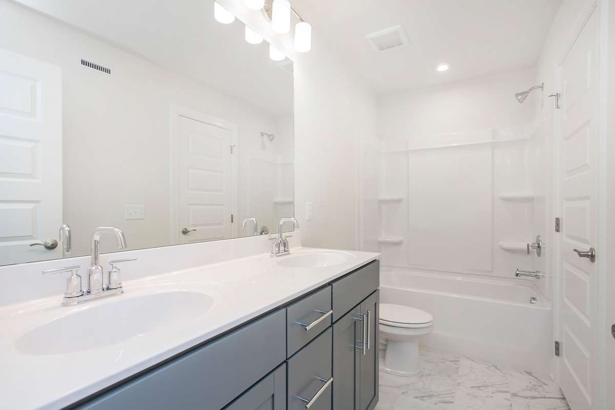 Jack and Jill style bathroom! Build a Lexington on a lot of your choice!! Photos are of an example home, all upgrades and finishes would be based on your selections!