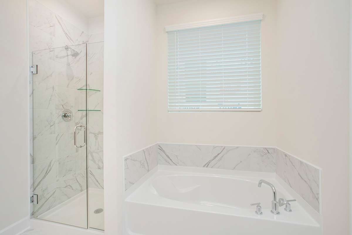 Owners bathroom! Choose from a separate tub and shower or oversized shower! Build a Lexington on a lot of your choice!! Photos are of an example home, all upgrades and finishes would be based on your selections!