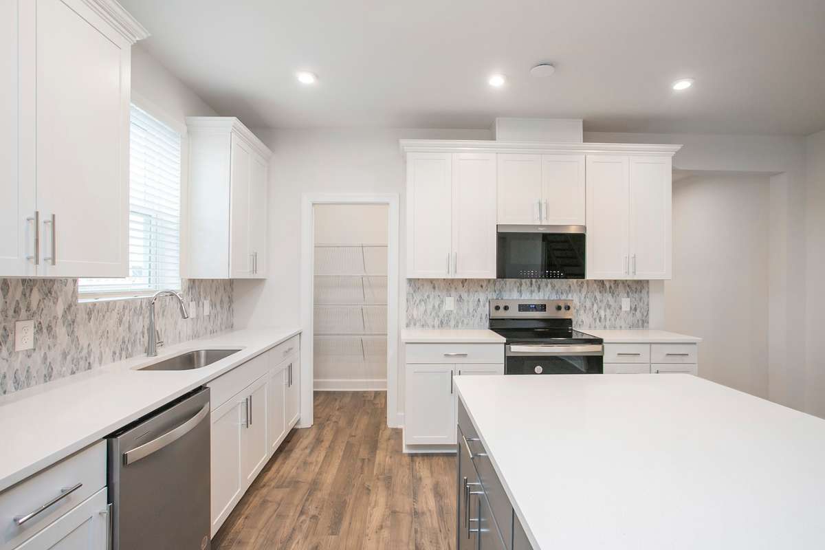 Kitchen area! Build a Lexington on a lot of your choice!! Photos are of an example home, all upgrades and finishes would be based on your selections!