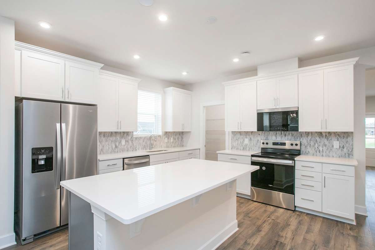 Kitchen area! Build a Lexington on a lot of your choice!! Photos are of an example home, all upgrades and finishes would be based on your selections!