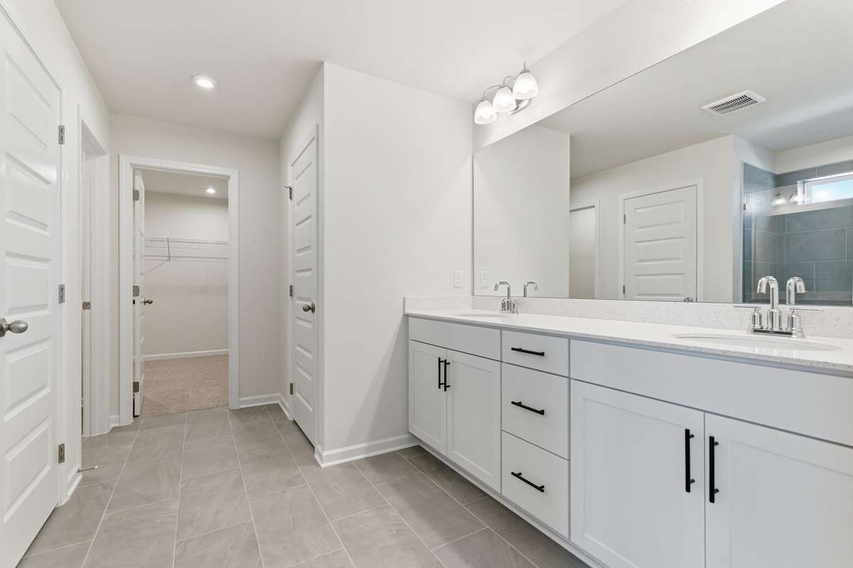 Dual vanity in the primary bathroom.