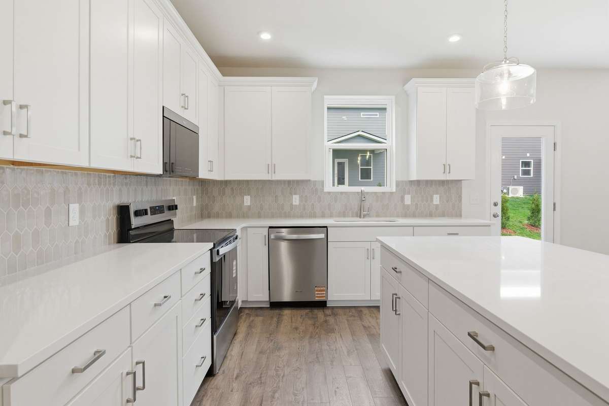 Soft-close cabinets and Quartz countertops.