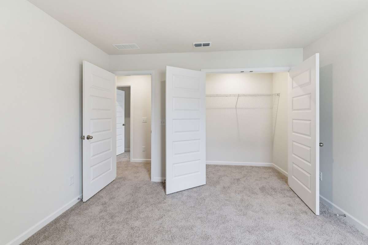 Bedroom 4 showcasing the large closets for secondary bedrooms.