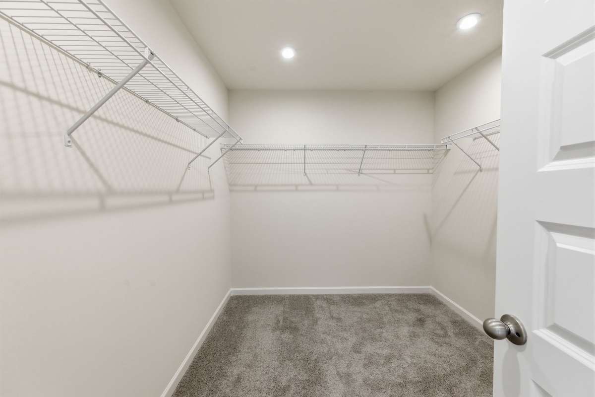 Primary closet with luxury shelving.