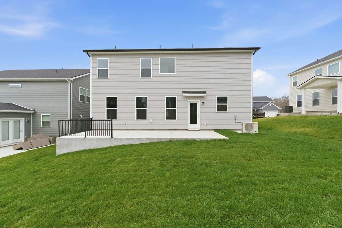 Well maintained grass with two hose bibbs to maintain your yard and/or wash your car.
