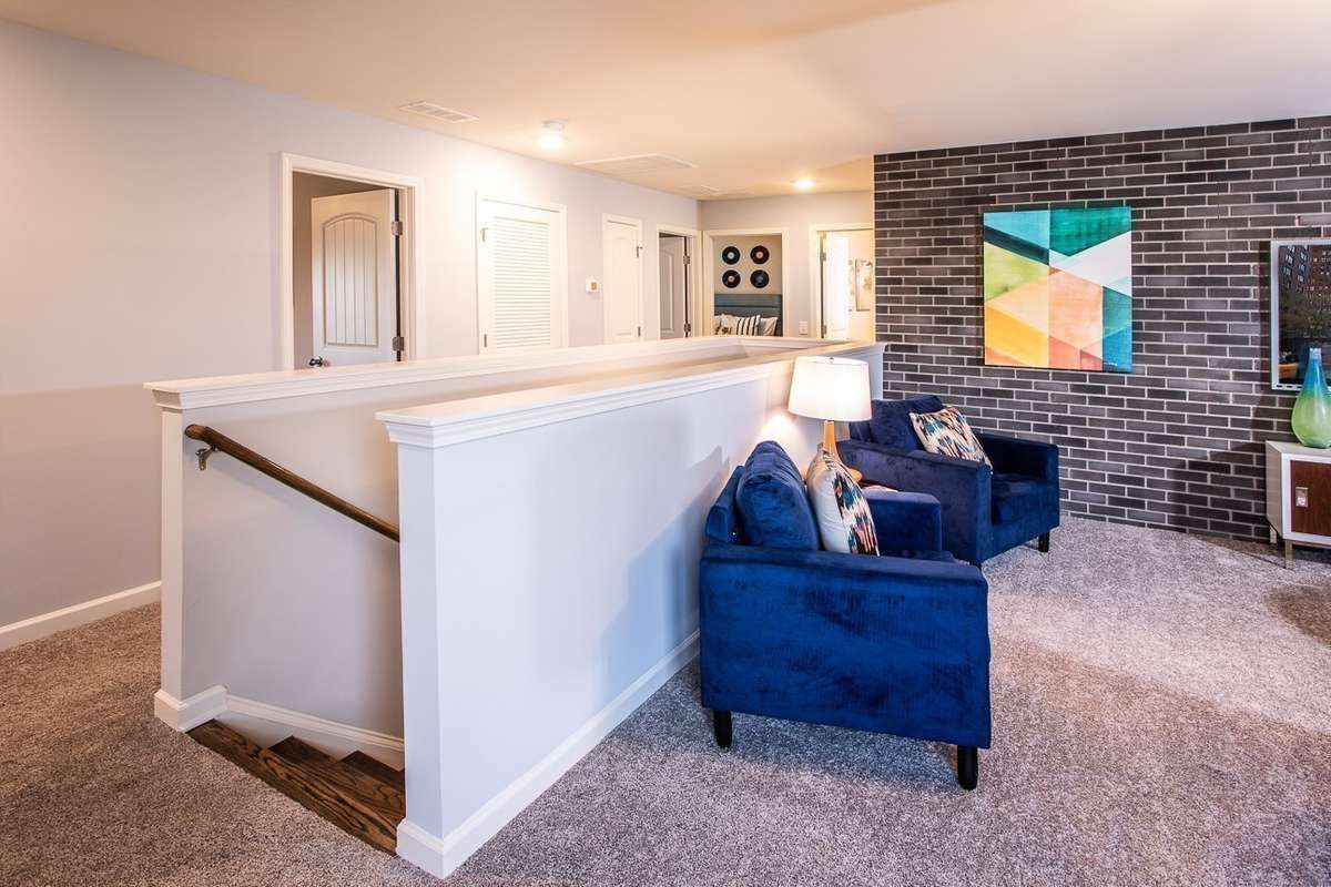 Large bonus room upstairs. *All photos are of previous model home*