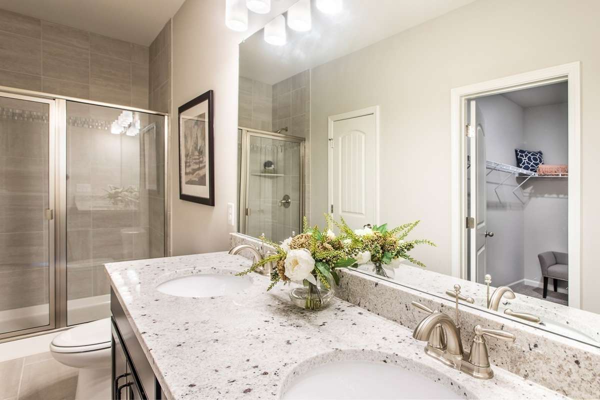 Choose between a tiled shower or tiled shower & garden tub at no additional cost. *All photos are of previous model home*