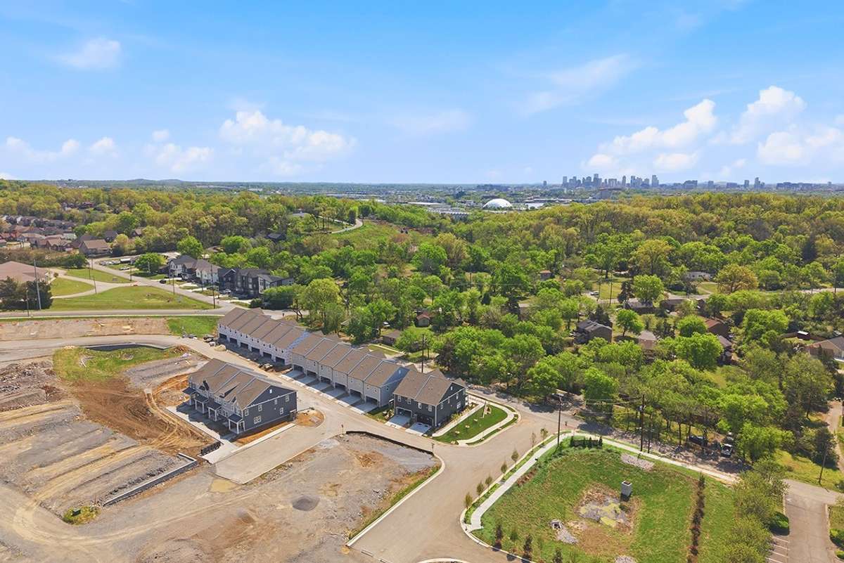 Aerial photo of community with downtown Nashville skyline
