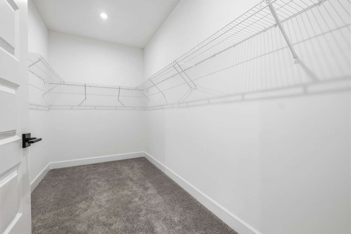Primary walk in closet.(Stock Photos of similar model)