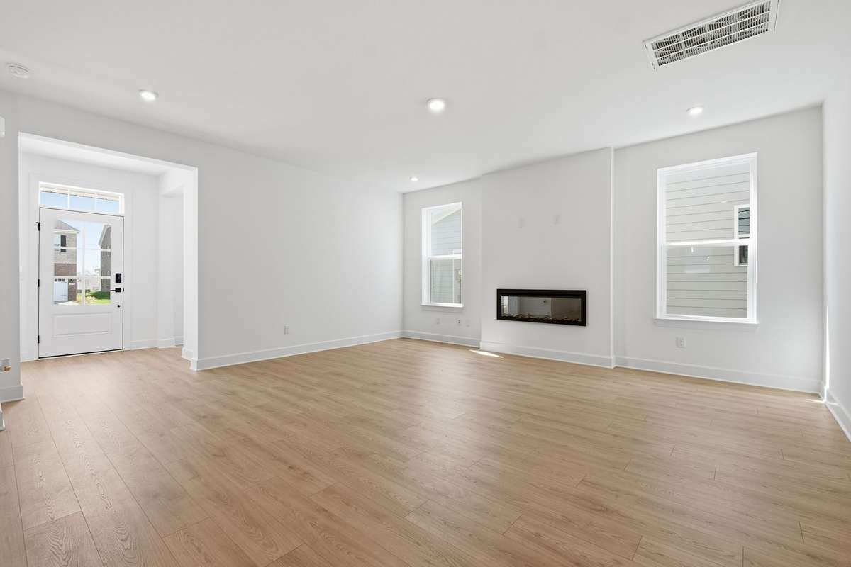 Great room with electric fireplace.(Stock Photos of similar model)
