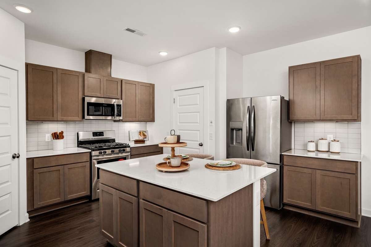 Picture of actual home being sold.  Home will be ready to move in for month of March.  Furniture will be removed, but curtains and appliances remain.