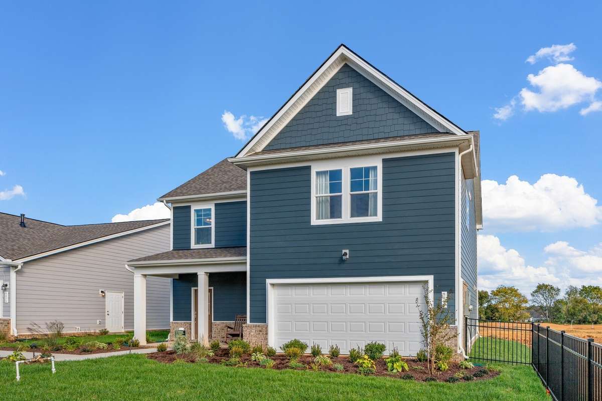 Picture of actual home being sold.  Driveway is complete and home is ready to move in!