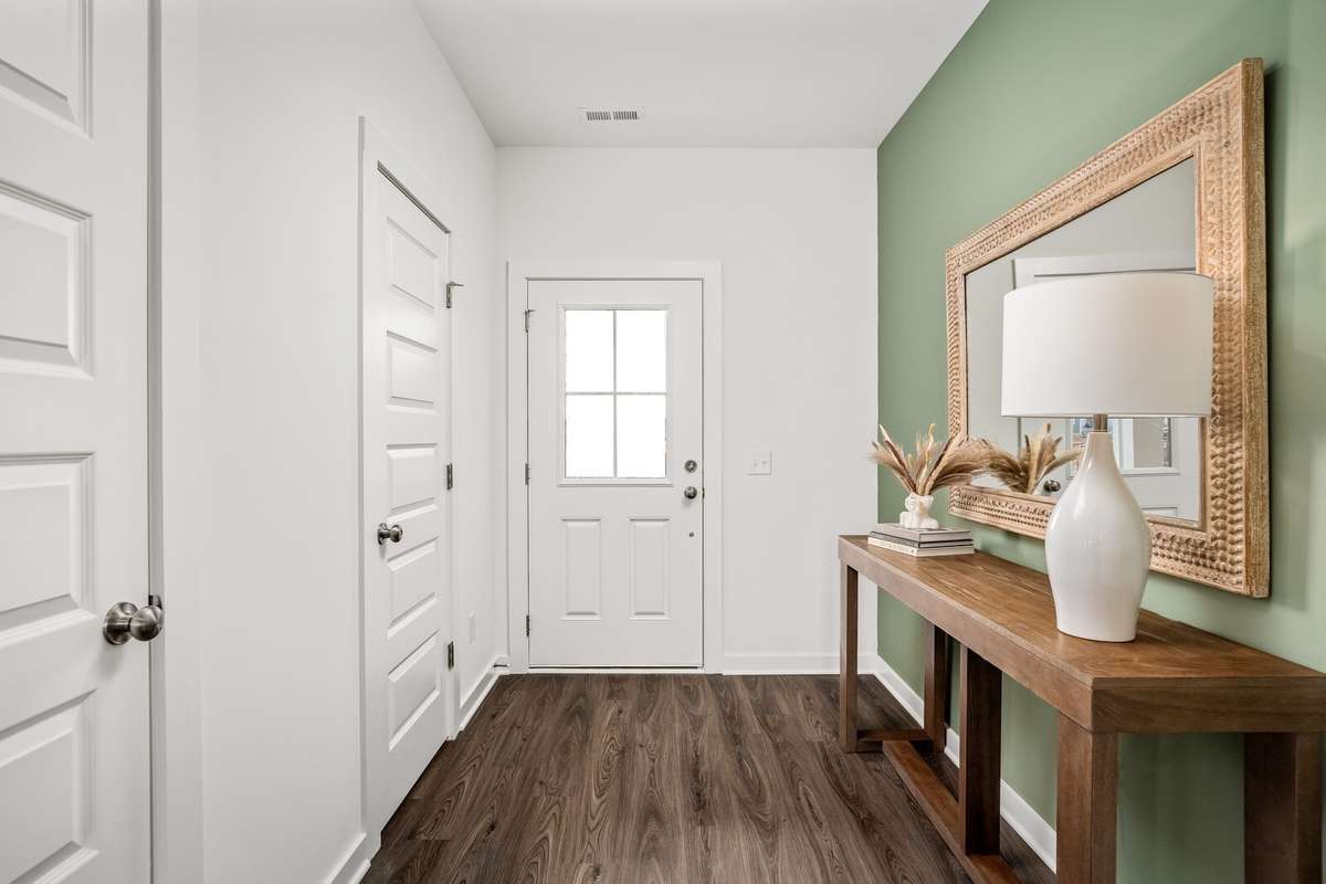 Picture of actual home being sold.  Home will be ready to move in for month of March.  Furniture will be removed, but curtains and appliances remain.