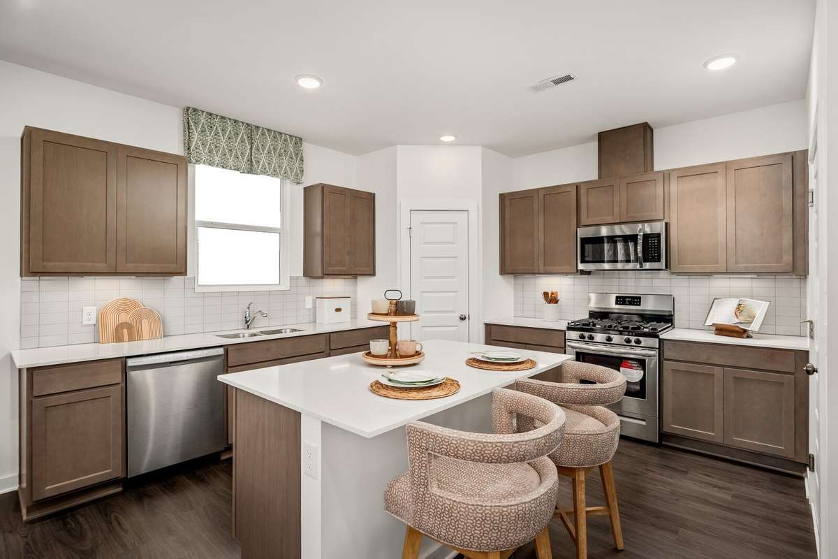 Picture of actual home being sold.  Home will be ready to move in for month of March.  Furniture will be removed, but curtains and appliances remain.