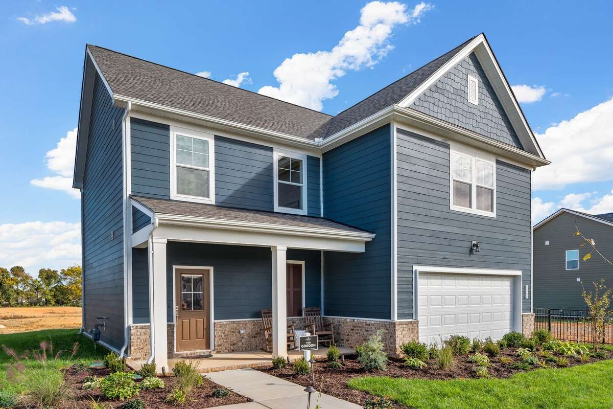 Picture of actual home being sold.  Driveway is complete and home is ready to move in!