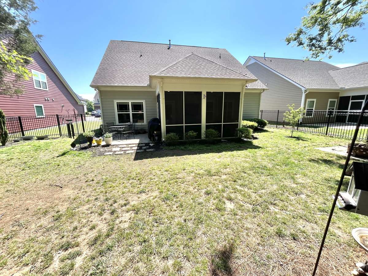 Nice sized back yard with black aluminum fence