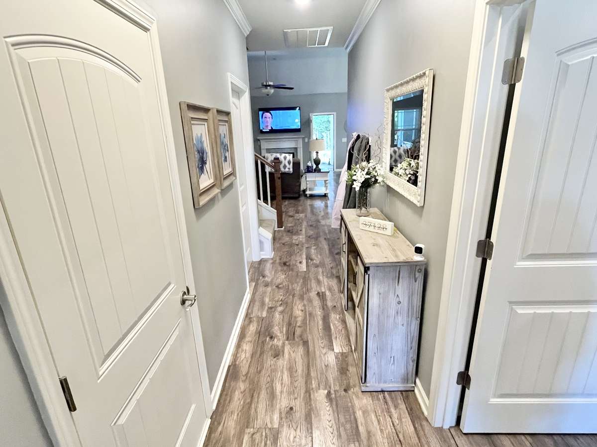 A foyer to give you a nice impression when you walk in the door. Note lots of extra laminate flooring in the house