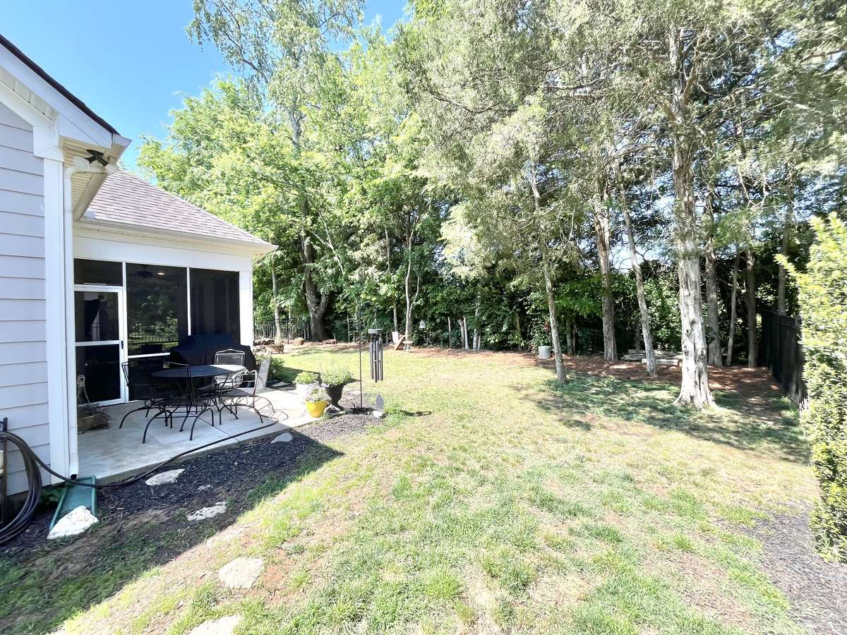 Another view showing the concrete pad for lounging and grilling